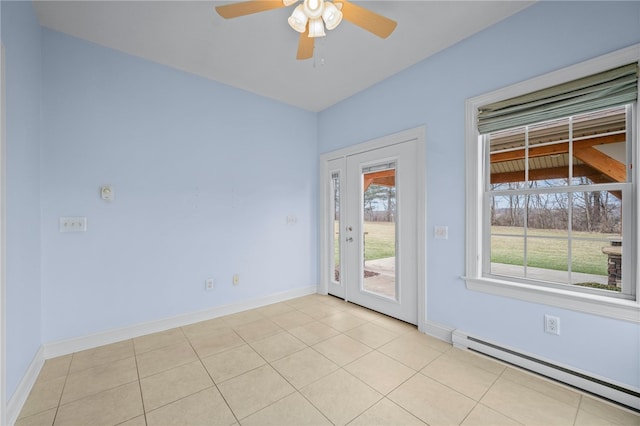 unfurnished room with light tile patterned floors, a baseboard radiator, and baseboards