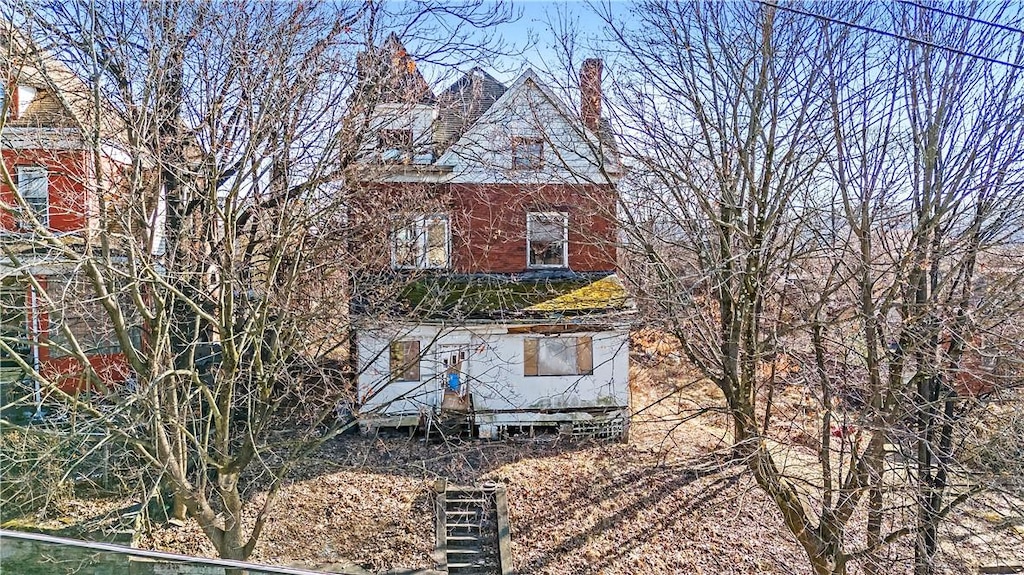 view of side of property with a chimney