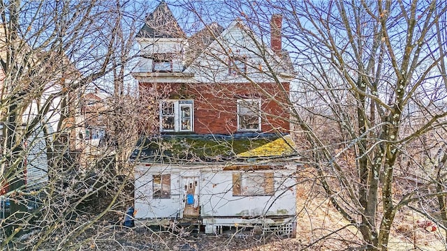 view of home's exterior with a chimney