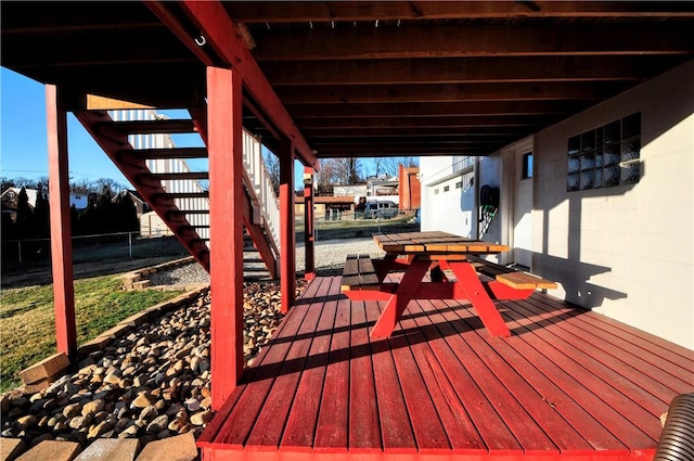 wooden terrace with stairs and fence