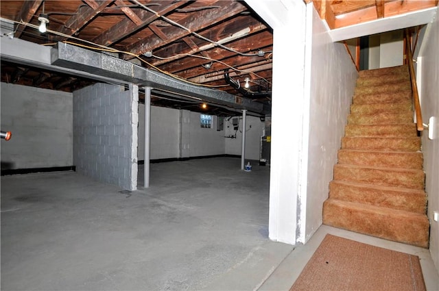 unfinished basement featuring stairway