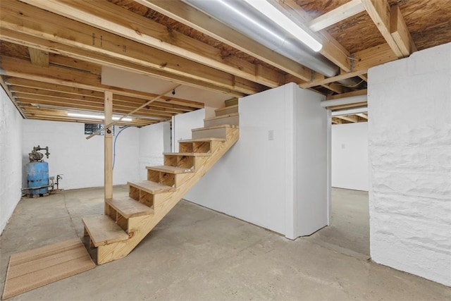 unfinished basement with stairs