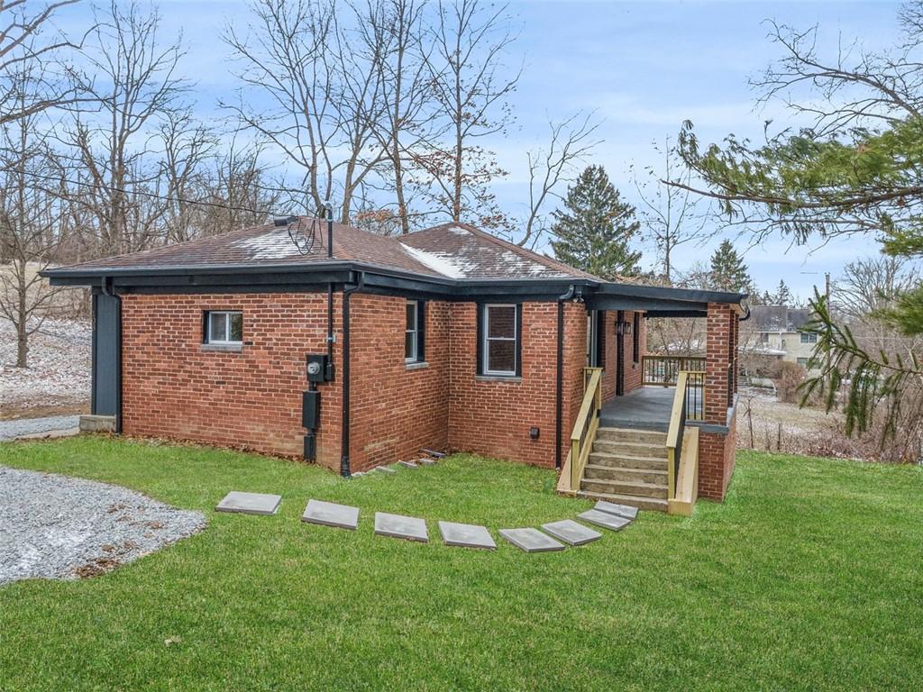 108 Gretna Rd, Chartiers, PA 15301 - view of property exterior with brick siding, a lawn, and roof with shingles