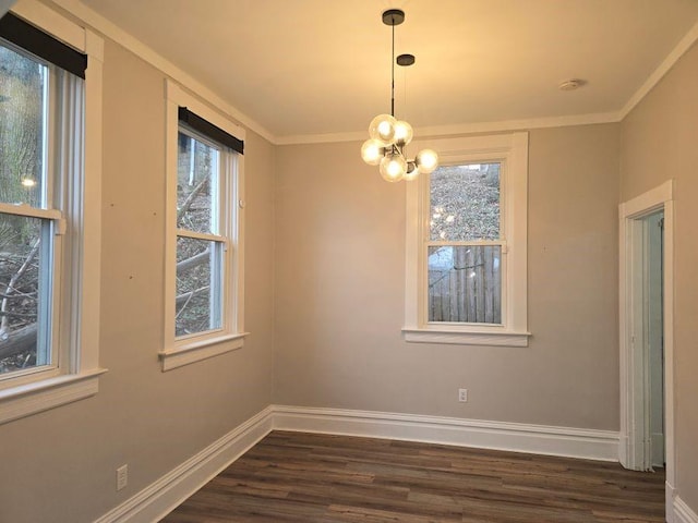 unfurnished dining area featuring dark wood-type flooring, a wealth of natural light, and baseboards