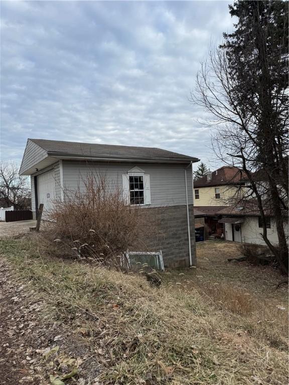 view of side of property with a garage