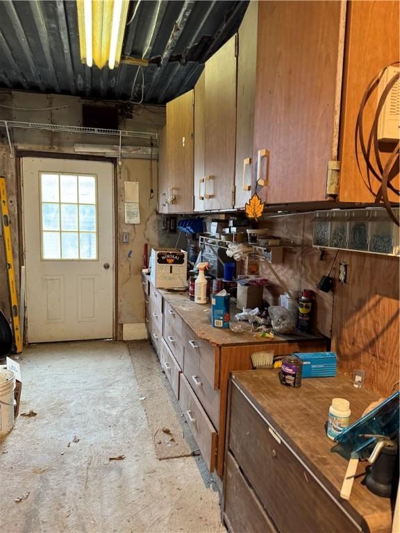 kitchen featuring brown cabinetry and butcher block countertops