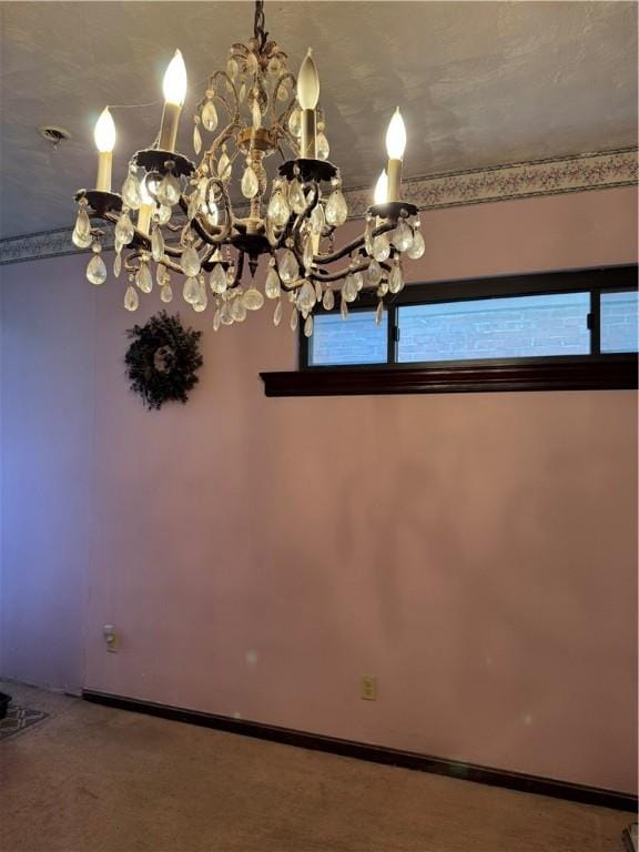 unfurnished dining area with an inviting chandelier, carpet, and baseboards