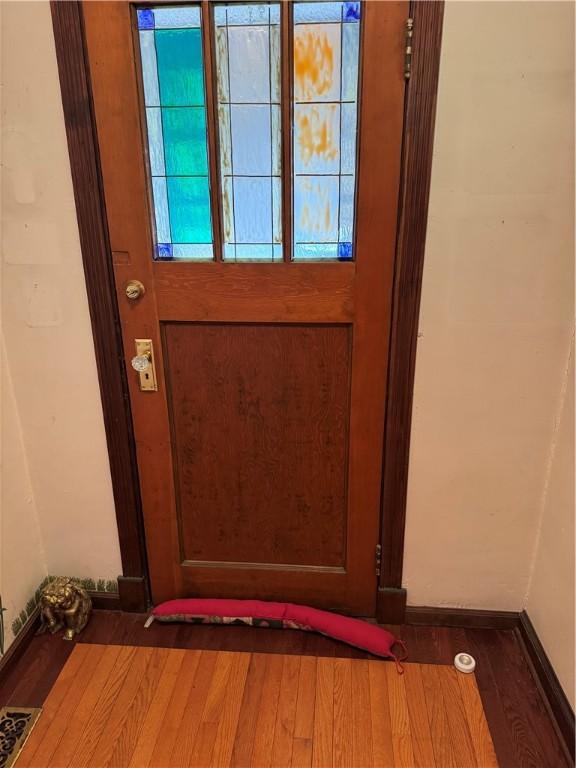 doorway featuring visible vents and wood finished floors