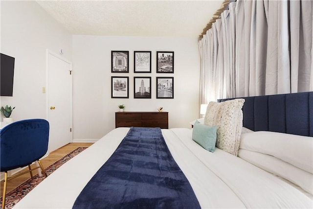 bedroom featuring wood finished floors