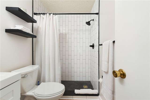 full bath featuring toilet, a shower stall, and a textured ceiling