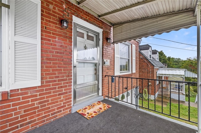 property entrance with brick siding