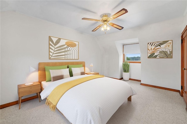 bedroom with baseboards, a ceiling fan, and light colored carpet