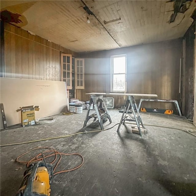 miscellaneous room with wooden walls