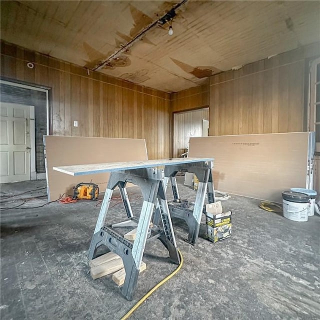 workout area featuring wooden walls