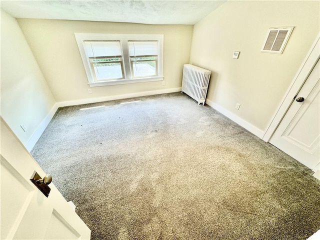 5620 Stanton Ave, East Liberty, PA 15206 - carpeted empty room with radiator heating unit, visible vents, and baseboards