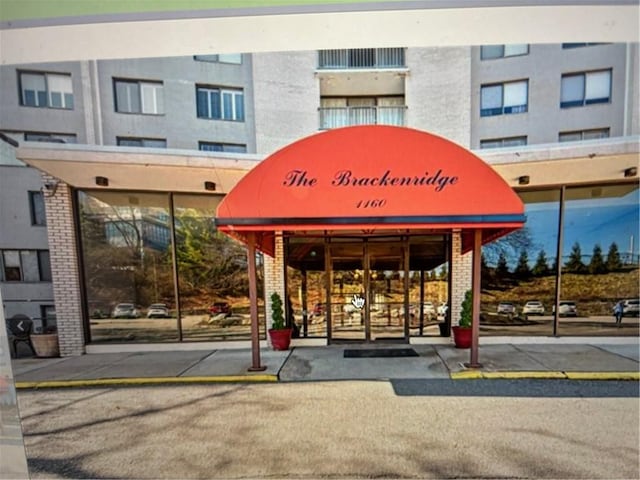 property entrance with brick siding