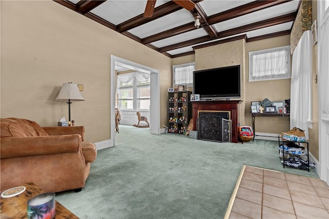 carpeted living room featuring a fireplace, coffered ceiling, beamed ceiling, and baseboards