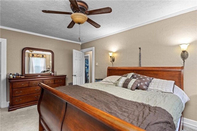 bedroom with light carpet, ornamental molding, a textured ceiling, and a ceiling fan