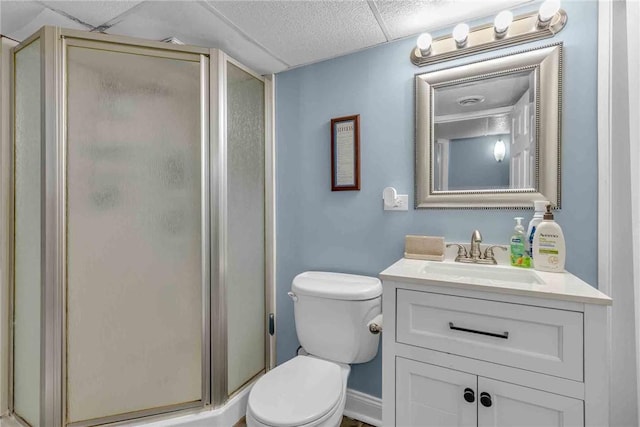 full bath with toilet, a stall shower, and vanity