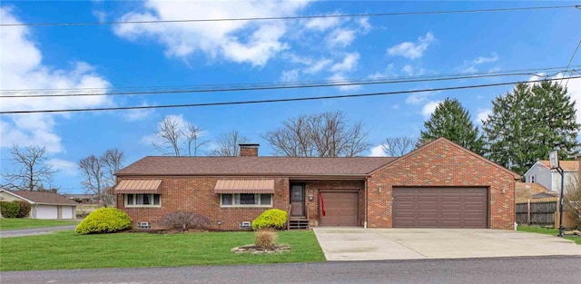 single story home featuring brick siding, concrete driveway, crawl space, a garage, and a front lawn