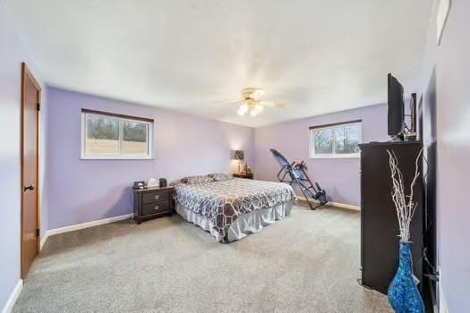 carpeted bedroom with baseboards