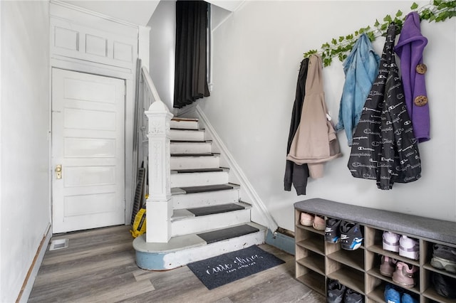 mudroom with baseboards and wood finished floors