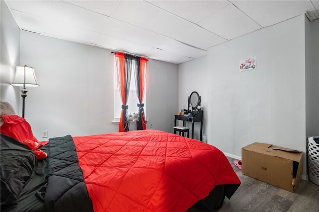 bedroom with wood finished floors