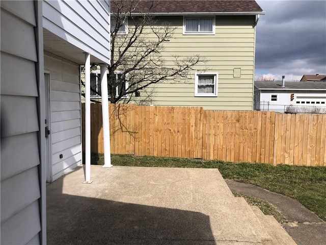 exterior space featuring a patio area and fence