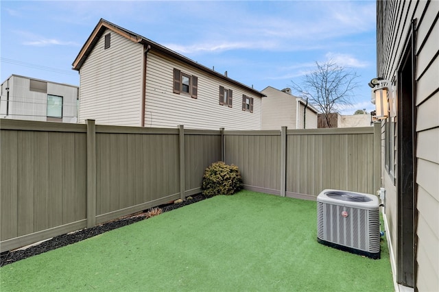 view of yard featuring a fenced backyard and cooling unit