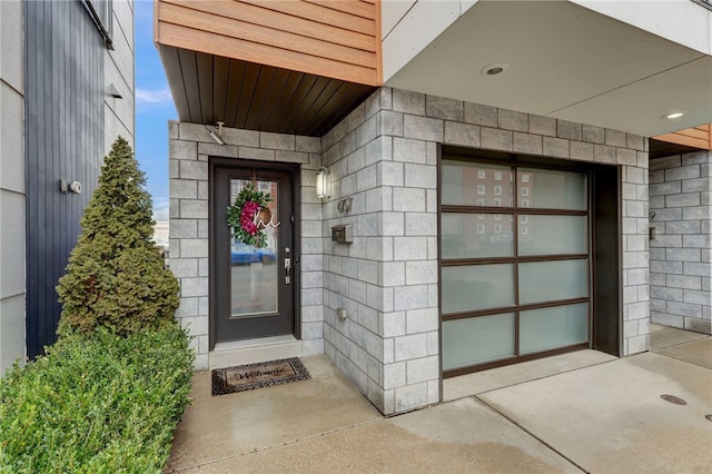 entrance to property featuring concrete driveway