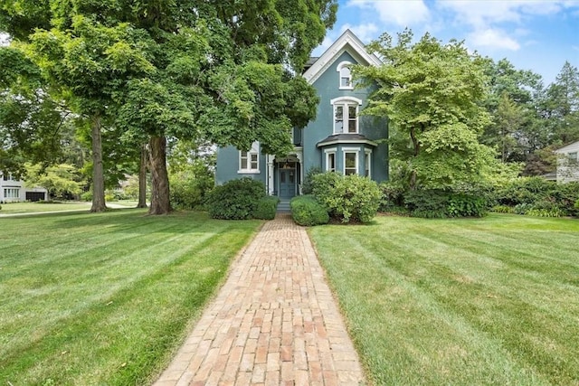 view of front of property with a front lawn and stucco siding