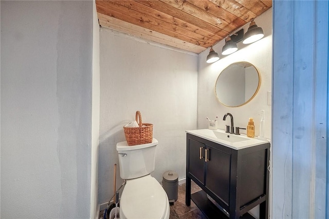 half bath featuring wooden ceiling, baseboards, vanity, and toilet