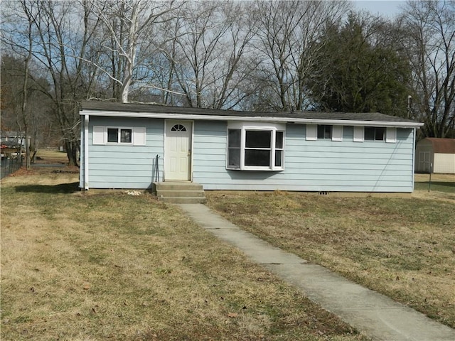 single story home with a front lawn