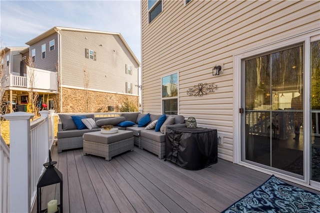 wooden terrace featuring outdoor lounge area