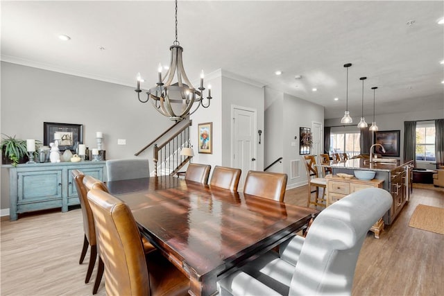 dining area with light wood-style floors, stairs, crown molding, and recessed lighting