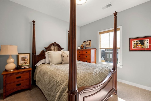 carpeted bedroom featuring visible vents and baseboards