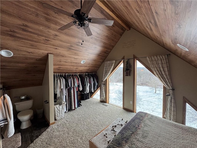 unfurnished bedroom with lofted ceiling with beams, a closet, carpet flooring, wood ceiling, and access to exterior