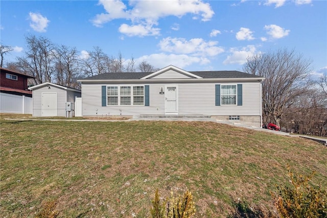 ranch-style house with an outbuilding, a front lawn, and a storage unit