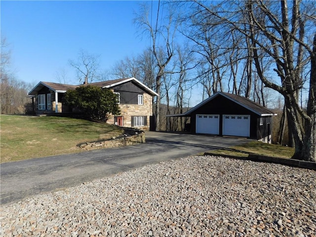 view of side of home featuring stone siding and a lawn