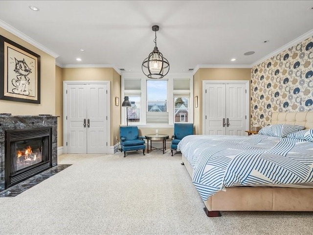 bedroom featuring a premium fireplace, ornamental molding, carpet floors, a closet, and recessed lighting