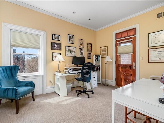 carpeted office with baseboards, visible vents, and ornamental molding