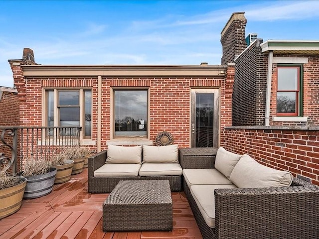 wooden deck with an outdoor living space