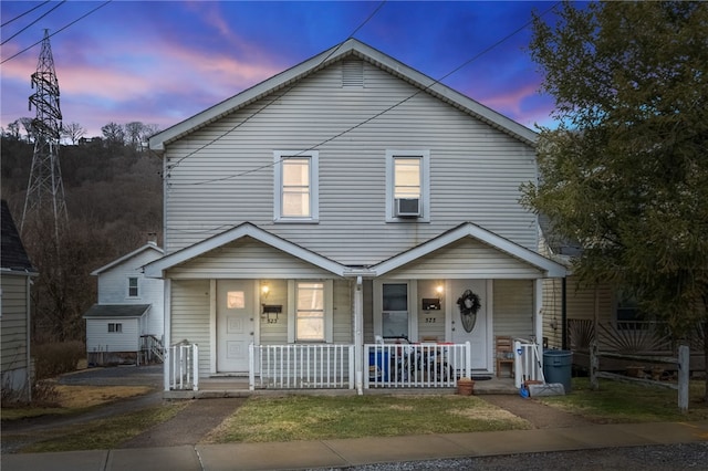 traditional-style home featuring a porch