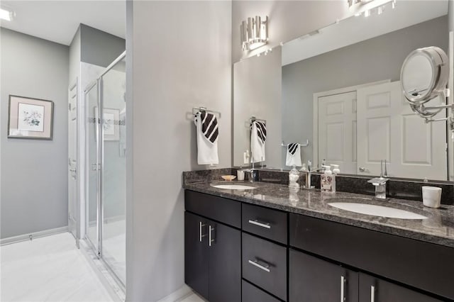 full bathroom with double vanity, visible vents, a stall shower, and a sink