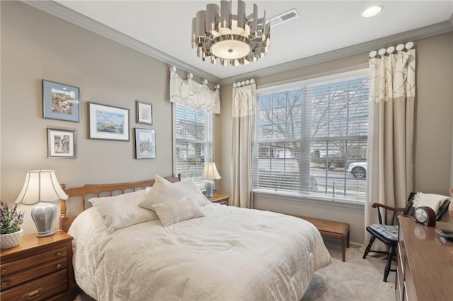 carpeted bedroom featuring crown molding, visible vents, and a chandelier