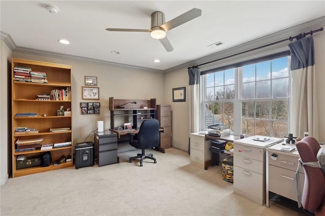 office area featuring ceiling fan, visible vents, light carpet, and ornamental molding