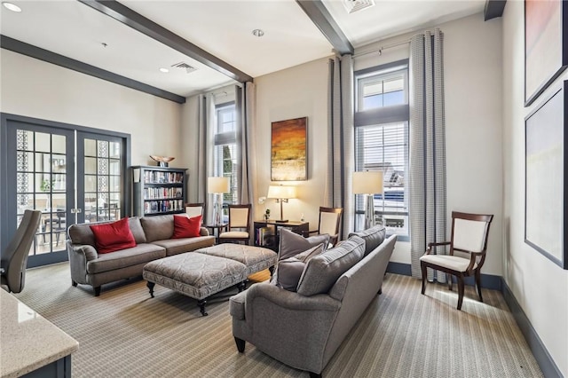 living area with visible vents, baseboards, beam ceiling, french doors, and light carpet