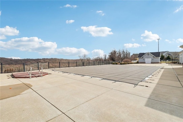 pool featuring a patio and fence