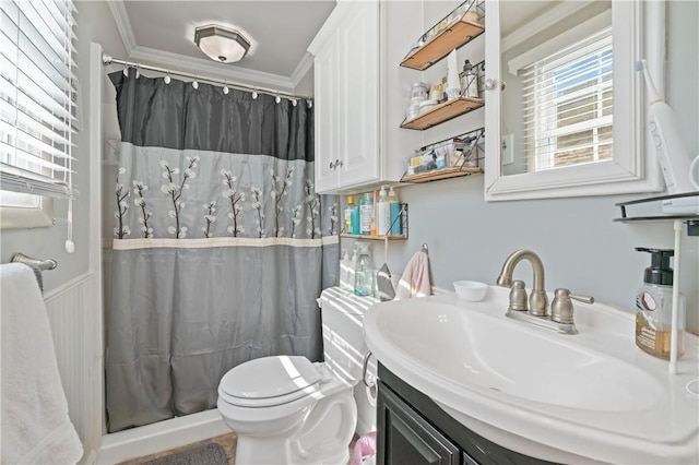 full bathroom featuring curtained shower, toilet, vanity, and ornamental molding