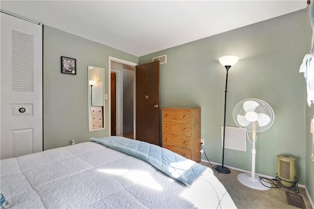 carpeted bedroom with baseboards and visible vents